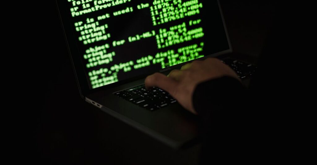 IT professional reviewing a security checklist on a laptop
