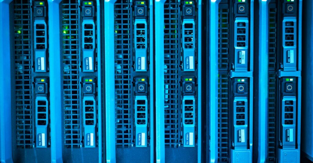 IT technician checking backup server storage racks