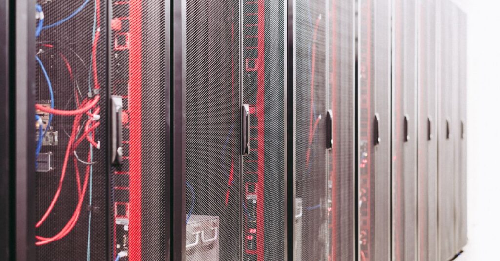 IT technician checking server equipment in a data center rack